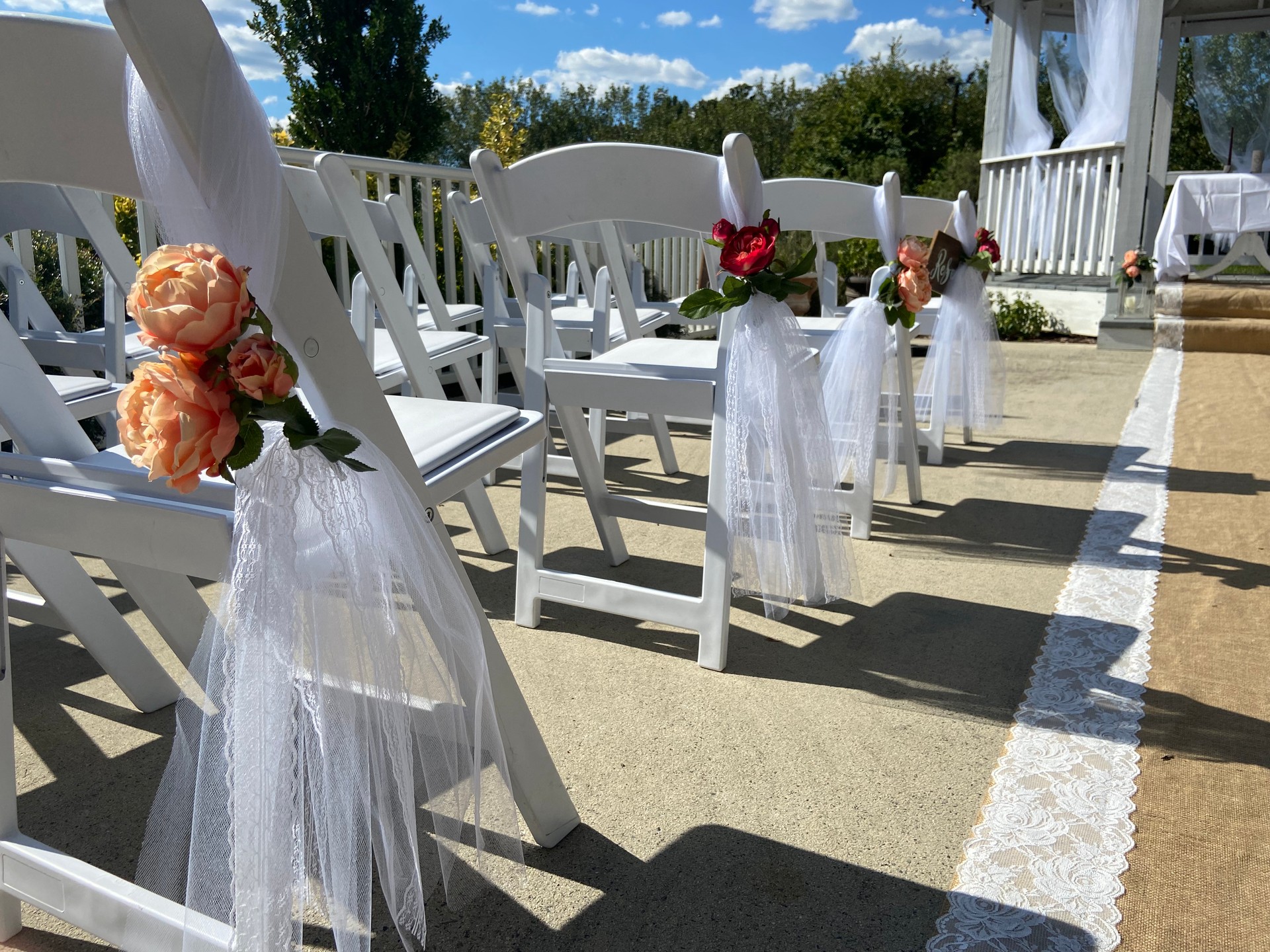 Decorative Roses and Tulle on Wedding Ceremony Chairs